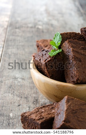 Similar – Chocolate brownie pieces on wooden background