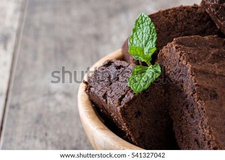 Similar – Chocolate brownie pieces on wooden background