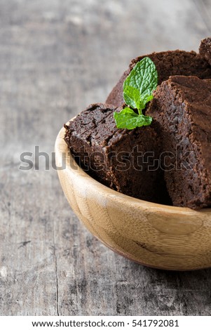 Similar – Chocolate brownie pieces on wooden background