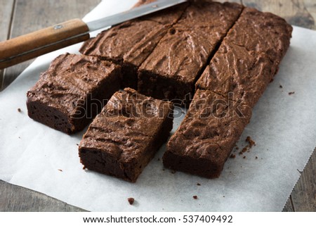 Image, Stock Photo Chocolate brownie pieces on wooden background