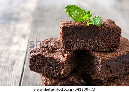 Similar – Chocolate brownie pieces on wooden background