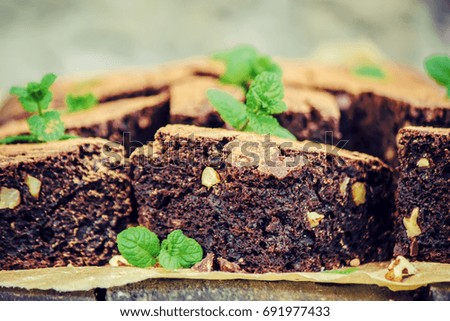 Similar – Chocolate brownie pieces on wooden background