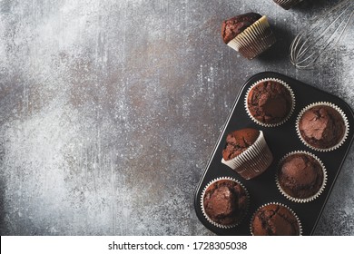 Chocolate brownies cacao muffins flat lay, baking concept, top view, copy space on dark background