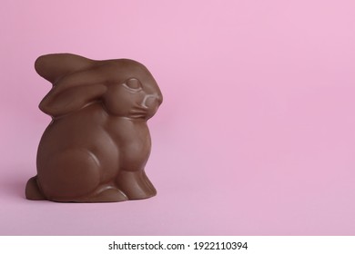 Chocolate bunny on pink background, space for text. Easter celebration - Powered by Shutterstock