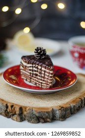 Chocolate Cacke On The Red Plate. Rustic Style. New Year And Christmas Concept