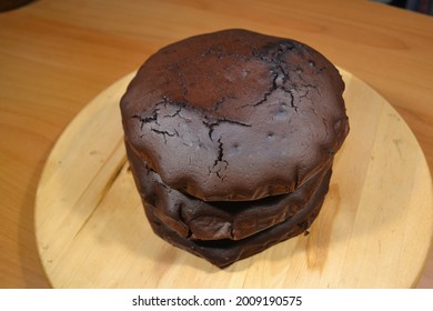 Chocolate Cake Baked Cakes Stacked On Top Of Each Other On A Turntable.