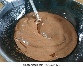 Chocolate Cake Batter In Metal Cauldron