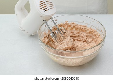 The Chocolate Cake Frosting Recipe. Mix Of Butter, Vanilla, And Cocoa Powder In A Glass Bowl Close Up On Kitchen Table