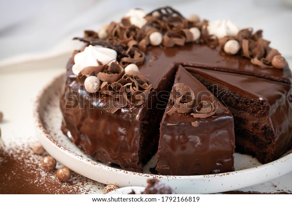 Chocolate cake with chocolate glaze and\
cream, \