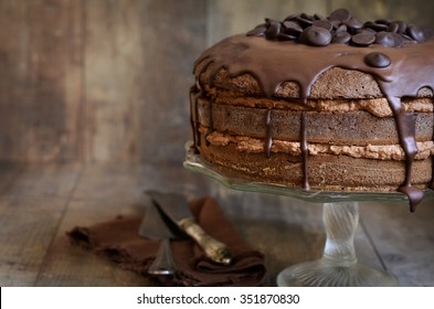 Chocolate Cake With Mascarpone On Rustic Background.