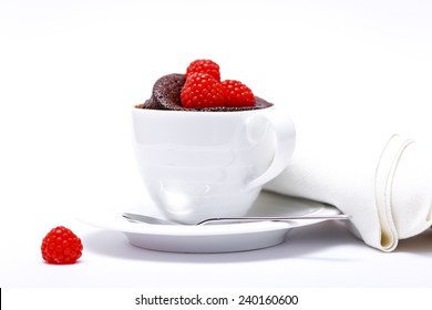 Chocolate Cake In A Mug On White Background With Spoon And Napkin