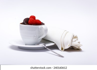 Chocolate Cake In A Mug On White Background With Spoon And Napkin