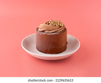 chocolate cake on a pink saucer on a pink background. horizontal composition - Shutterstock ID 2129635613