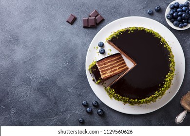 Chocolate Cake On A Plate. Grey Stone Background. Copy Space. Top View.