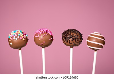 Chocolate Cake Pops On A Pink Background