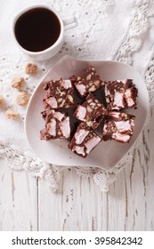 Chocolate Cake Rocky Road And Coffee On The Table. Vertical View From Above
