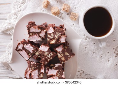 Chocolate Cake Rocky Road And Coffee On A Table Close-up. Horizontal View From Above
