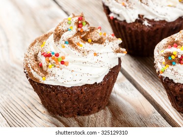 Chocolate cakes with creamy top on Wood Table Background,
