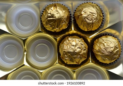 Chocolate Candies In A Box In A Gold Wrapper