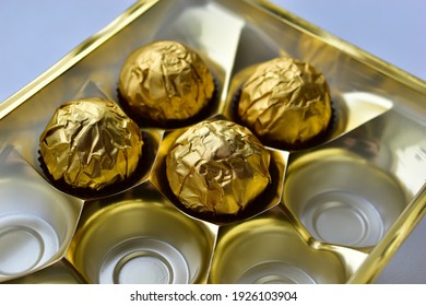 Chocolate Candies In A Box In A Gold Wrapper