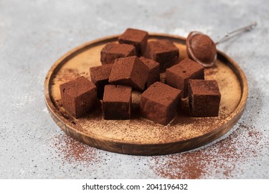 Chocolate candies. Delicious dessert on a plate. Dark chocolate truffles. Macro photography of sweets. Candy Cut. Cacao - Powered by Shutterstock