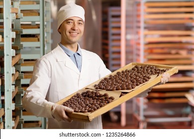 chocolate candies process making master factory worker - Shutterstock ID 1235264866
