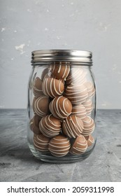 Chocolate Candy In Glass Container And Jar
