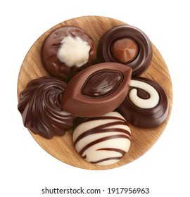 Chocolate Candy In Wooden Bowl Isolated On White Background With Clipping Path And Full Depth Of Field. Top View. Flat Lay