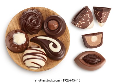 Chocolate Candy In Wooden Bowl Isolated On White Background With Clipping Path And Full Depth Of Field. Top View. Flat Lay