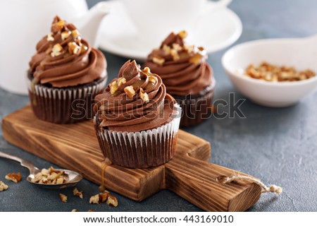 Chocolate caramel cupcake with nuts and butterscotch syrup