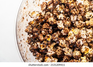 Chocolate Caramel Popcorn On A Solid Background