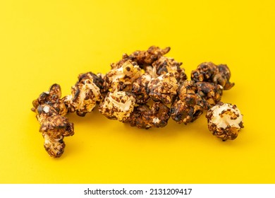 Chocolate Caramel Popcorn On A Solid Background