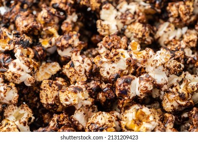 Chocolate Caramel Popcorn On A Solid Background