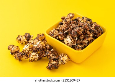 Chocolate Caramel Popcorn On A Solid Background