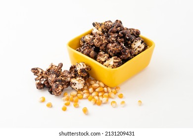 Chocolate Caramel Popcorn On A Solid Background