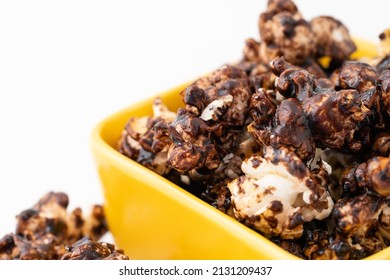 Chocolate Caramel Popcorn On A Solid Background