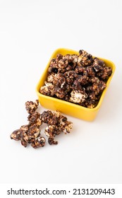 Chocolate Caramel Popcorn On A Solid Background