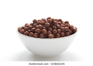 Chocolate Cereal Balls In A Bowl Isolated On White Background.