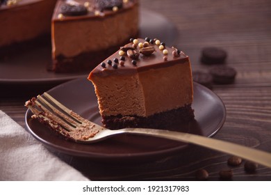 Chocolate Cheese Cake On The Wooden Table With Fork