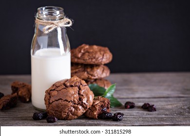 Chocolate Cherry Cookies And A Bottle Of Milk 
