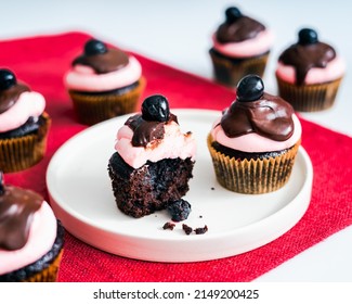 Chocolate Cherry Cupcakes With Pink Frosting