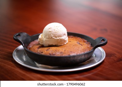 Chocolate Chip Cookie Bake With Vanilla Ice Cream, In A Cast Iron Dish