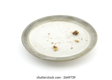 Chocolate Chip Cookie Crumbs On A Pottery Plate.