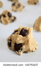 Chocolate Chip Cookie Dough Ball On Parchment Paper