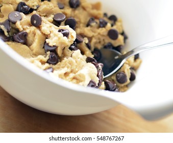 Chocolate Chip Cookie Dough In Mixing Bowl With Spoon