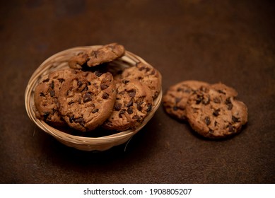 
Chocolate Chip Cookies In A Bowl And Dark Background