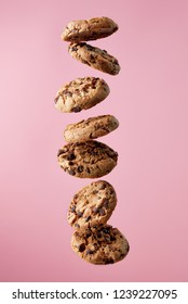 Chocolate Chip Cookies Falling, Pink Background, Food Levitation