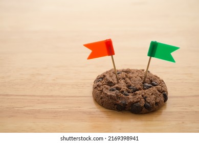 Chocolate Chip Cookies With Green And Red Flag On Wooden Table Background Copy Space. Cookies Website Internet Homepage Policy Accepted Or Blocks Concept.