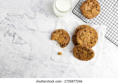 Chocolate chip cookies with milk on marble background. Top view. Flat lay. Space for text. - Powered by Shutterstock