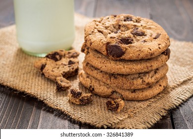 Chocolate chip cookies with milk on wooden table - Powered by Shutterstock